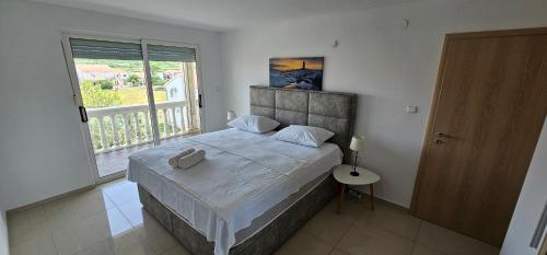 Postel nebo postele na pokoji v ubytování Elizabeta Apartments