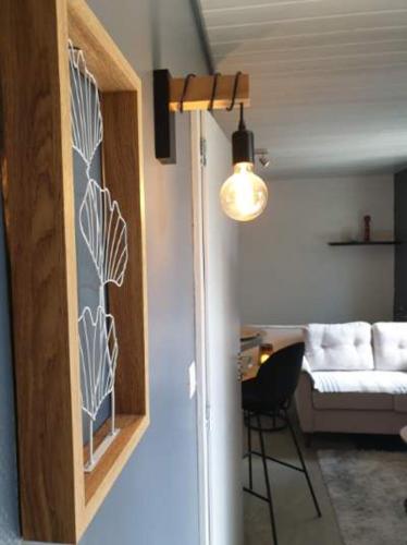 a living room with a white couch and a chair at I have a dream in Colmar