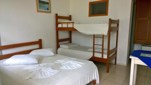 Postel nebo postele na pokoji v ubytování Rondinha Hotel
