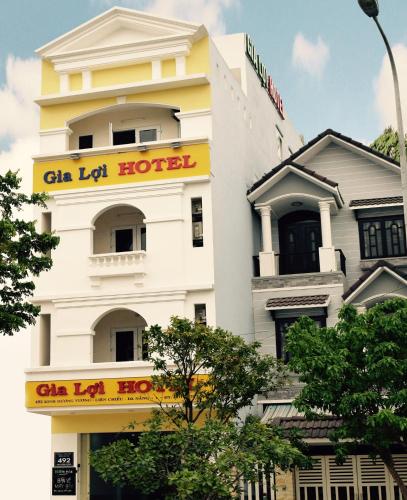 a white building with a sign on it at Gia Loi Hotel in Da Nang