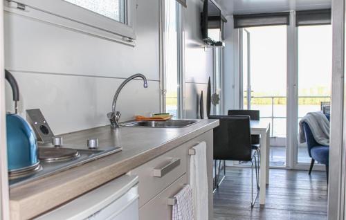 a kitchen with a sink and a counter top at Madrid in Lelystad
