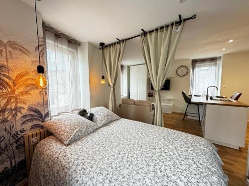 Postel nebo postele na pokoji v ubytování Le studio des Abers