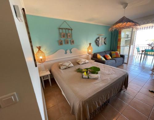a bedroom with a large bed in a room at Couleur Caraïbes-COCOBEACH MARTINIQUE PIERRE et VACANCES in Sainte-Luce