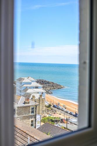 a view of a beach from a window at The Wellington Hotel in Ventnor