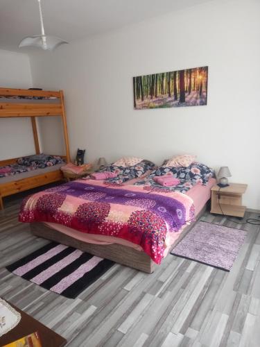 Postel nebo postele na pokoji v ubytování Grevia Apartmanok