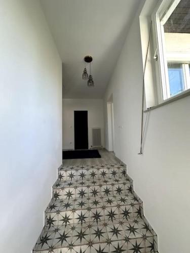 a hallway with a tile floor in a house at Schättihof in Müllendorf