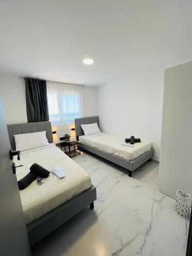 Ένα ή περισσότερα κρεβάτια σε δωμάτιο στο Filimena Villa