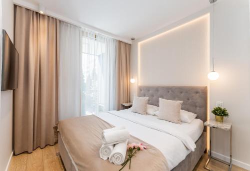 Posteľ alebo postele v izbe v ubytovaní Ga Luxury Apartments M54