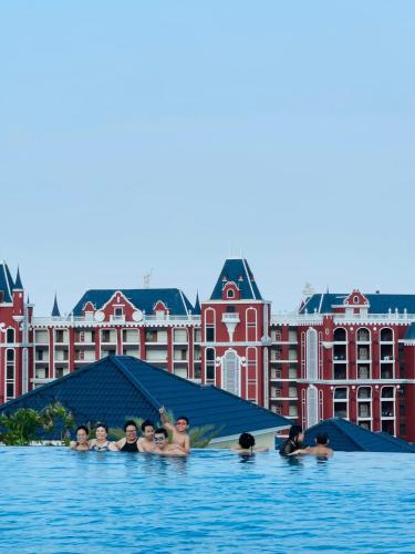 a group of people in the water at a hotel at Biệt thự 3 phòng ngủ Novaworld Phan Thiết in Bình Sum