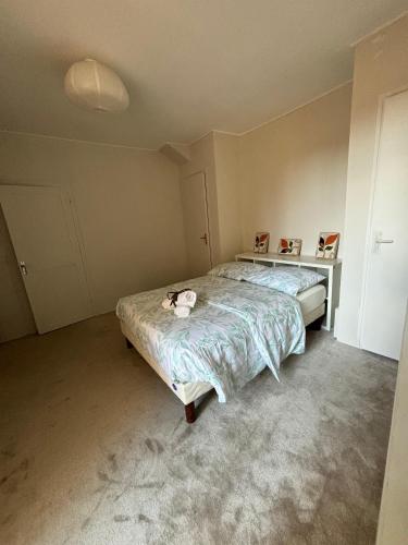 a bedroom with a bed with a cat on it at LA BELLE ETAPE in Capestang