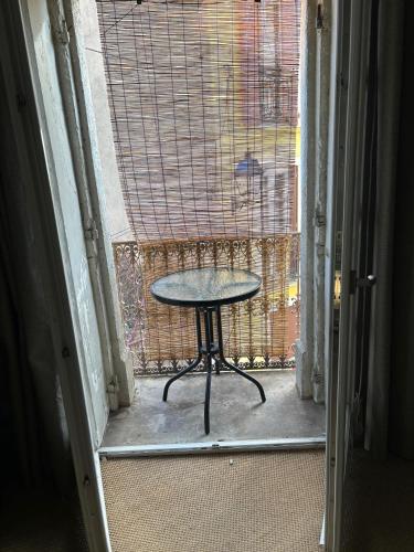a table in the doorway of a room with a window at LA BELLE ETAPE in Capestang