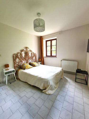 Postel nebo postele na pokoji v ubytování Moulin du château