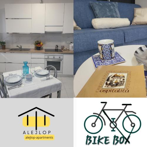 a kitchen and a table with a bike on it at BLANC & CHIC Appartamento con giardino in Gorizia