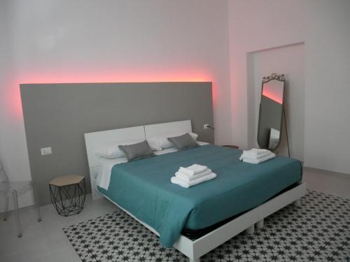 Giường trong phòng chung tại Casa vacanza B&G