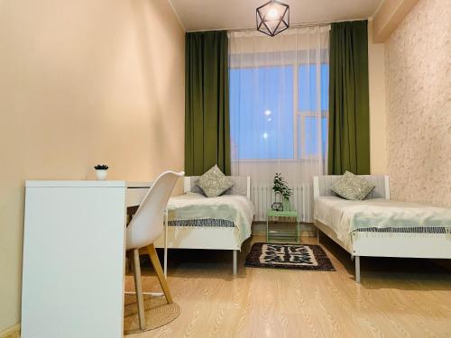 Ένα ή περισσότερα κρεβάτια σε δωμάτιο στο Nomad Airport B&B