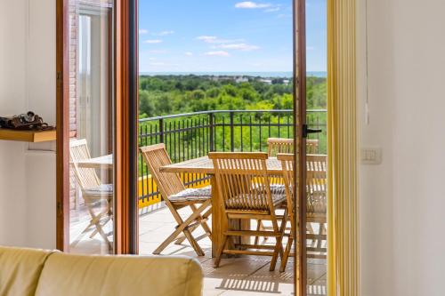 a view of a balcony with a table and chairs at Villa Umag Istria seaview private pool and garage by Rentistra in Umag