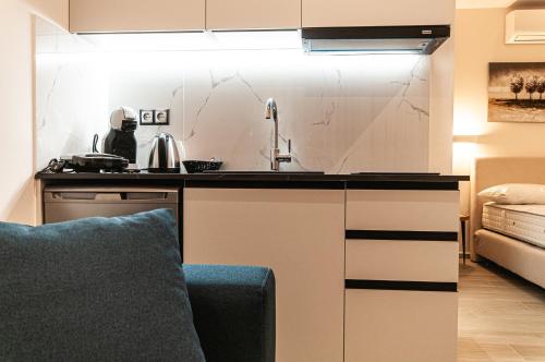 a kitchen with a sink and a counter top at Boutique apartments Myesis in Samothráki
