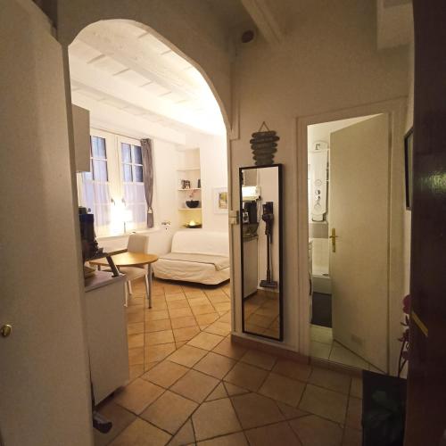 a hallway with a mirror and a living room at La Loge Du Vieux Lyon in Lyon