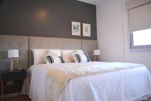 En eller flere senge i et værelse på GrandView Hotel Buenos Aires