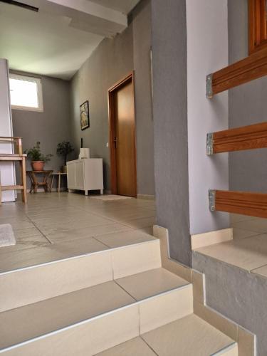 a hallway with stairs leading to a room at Apartments and pansion M&R in Turanj