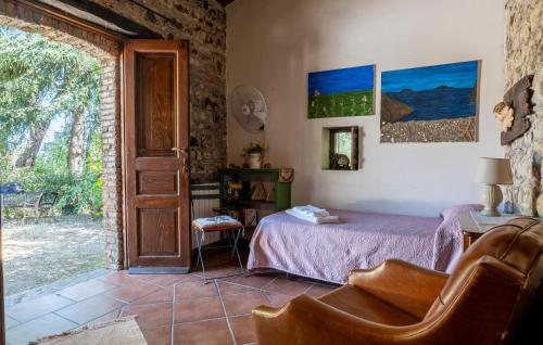 a bedroom with a bed and a table in a room at 4 Bedroom Gorgeous Home In Acquedolci in Acquedolci