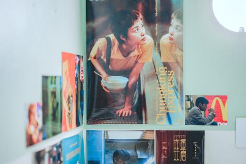 a book shelf filled with books in a library at Chungking Mansions Busan in Busan