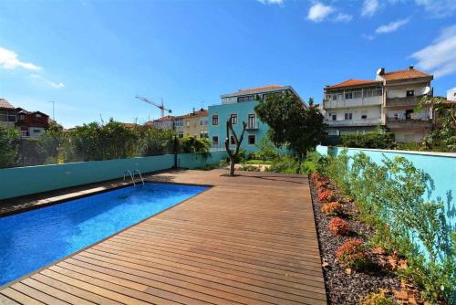 a swimming pool on the side of a building at North Side in Porto