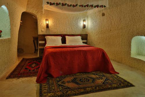 Demisos Caves Hotelにあるベッド