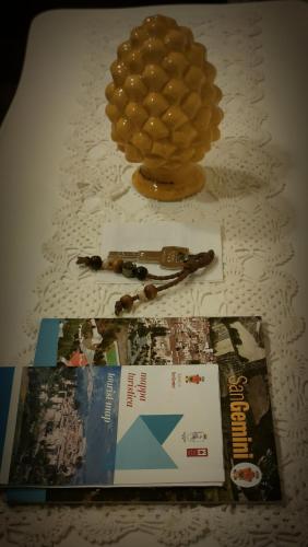 a table topped with a magazine and a honey jar at Dal Podestà in San Gemini