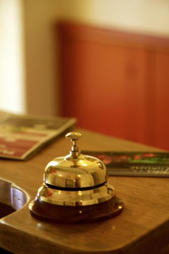a bell sitting on top of a stove at Nouvel Hotel in Saint-Raphaël