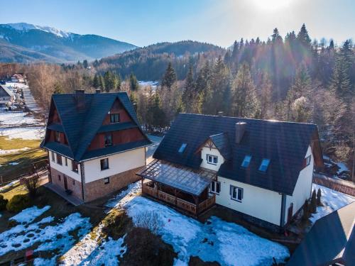 an aerial view of a house in the snow at Jelonek Zawoja in Zawoja