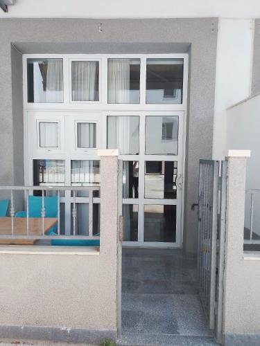 a door of a building with a window at Božikovina Beach Rooms in Podstrana