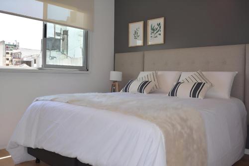 En eller flere senge i et værelse på GrandView Hotel Buenos Aires