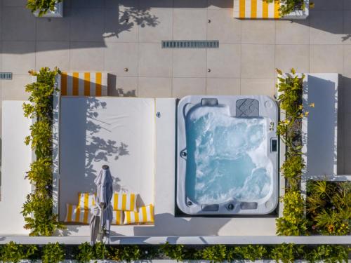 a rendering of a building with a bathtub at Patricia Suites in Faliraki