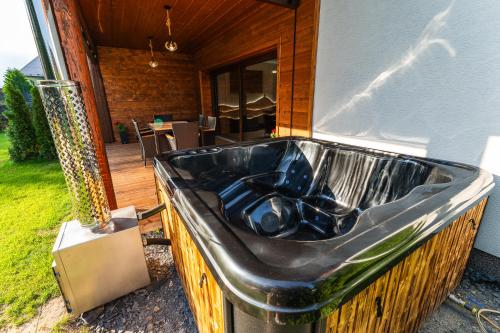 a bath tub sitting outside of a house at Luxapart Golf Ostravice in Ostravice