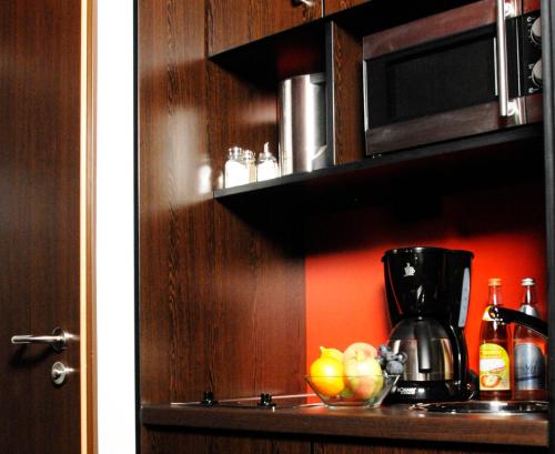 Η κουζίνα ή μικρή κουζίνα στο Stay2Munich Hotel & Serviced Apartments