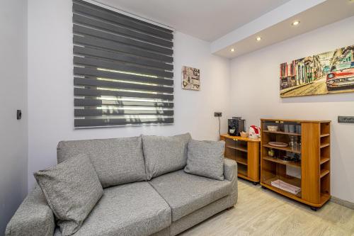 a living room with a couch and a window at Bellona in Malinska