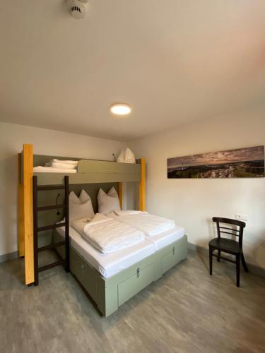Ένα ή περισσότερα κρεβάτια σε δωμάτιο στο Hostel Balingen