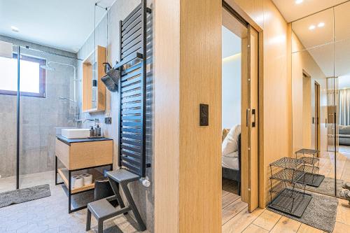 a bathroom with a sink and a shower with a sink at Pomorskie Apartamenty Aquarius in Sopot