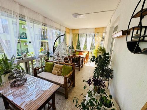 a living room with a couch and a table at Karakum Villa in Ureki
