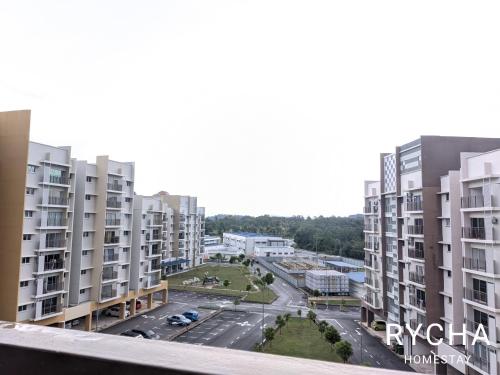 an aerial view of a city with tall buildings at Rycha Homestay A famosa near Waterpark in Kampong Pulau Sebang