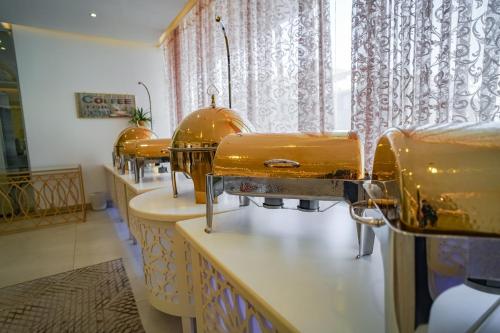 a row of sewing machines in a room at Emaar Legend in Makkah
