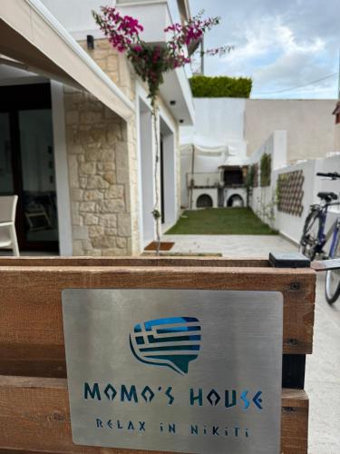 a sign in front of a house at Momo's House in Nikiti
