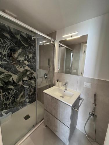 a bathroom with a sink and a shower at Casa Boccardi in Taranto