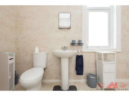 a bathroom with a toilet and a sink at Darlington Modern 2 Bed Apartment Great for Contractors in Darlington