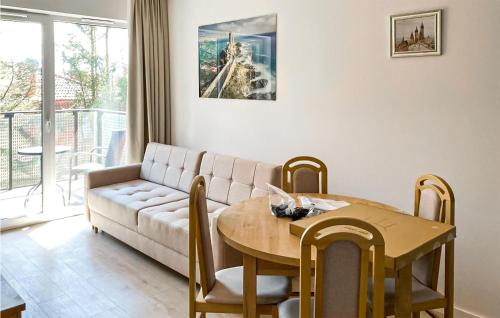 a living room with a couch and a table at 1 Bedroom Stunning Apartment In Mielno in Mielno