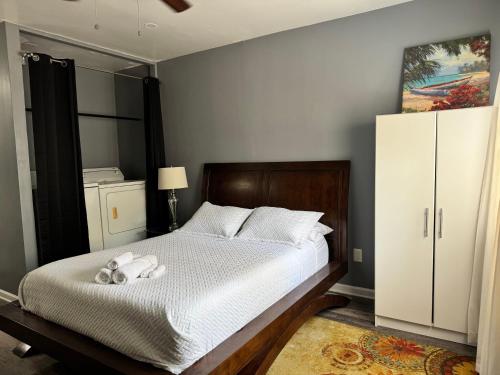 a bedroom with a bed with a stuffed animal on it at Budget friendly studio apt in historic Springfield in Jacksonville