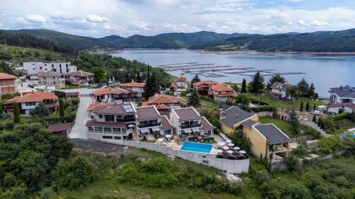 an aerial view of a town next to a lake at Club Houses StefVall in Glavatartsi