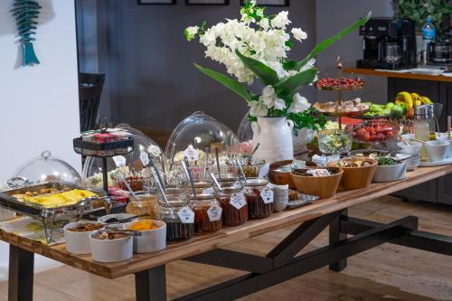 a buffet of desserts and food on a table at True Blue Boutique Hotel Kalkan in Kalkan