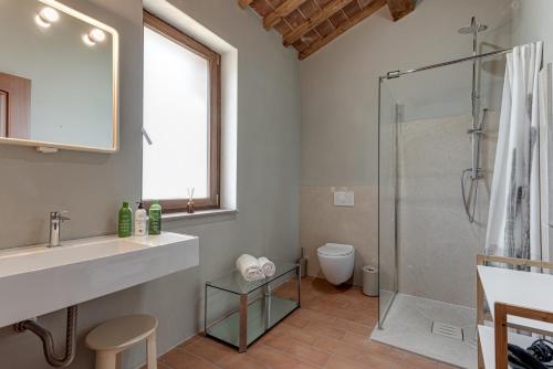 a bathroom with a sink and a shower at Villa San Giuseppe Scirocco in Montecatini Val di Cecina